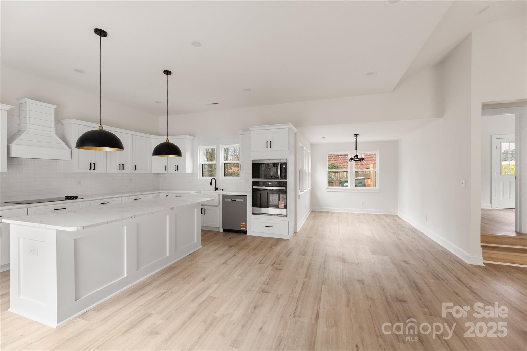 3021 Whitson Road Gastonia, NC 28054 - Photo 14 of 31 a view of center island wooden floor and windows