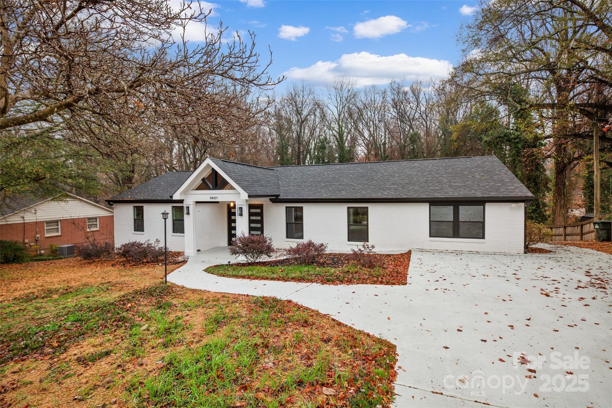 3021 Whitson Road Gastonia, NC 28054 - Photo 2 of 31 a front view of a house with a yard covered in snow