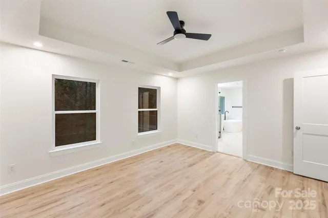 a view of empty room with windows