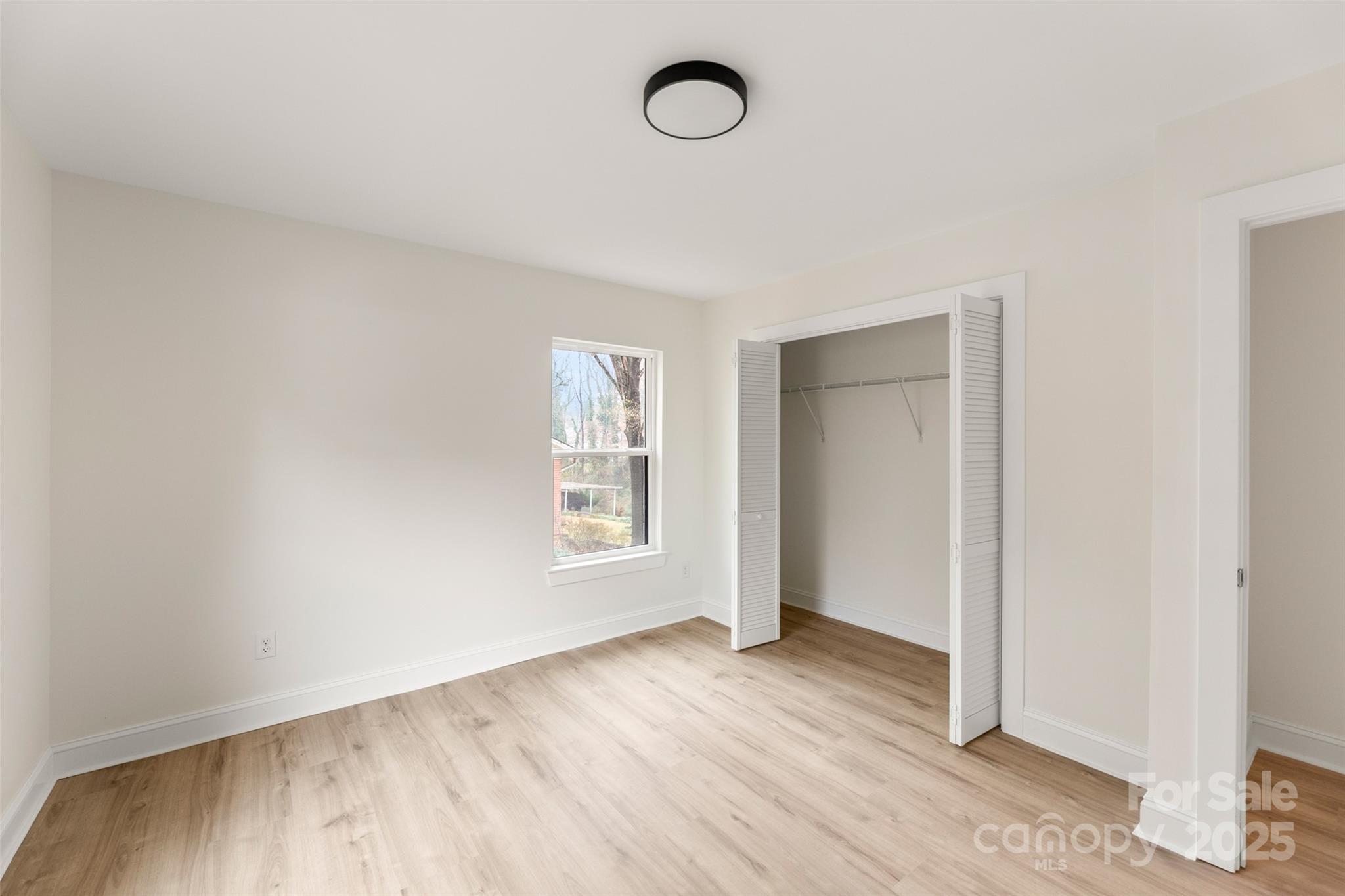 3021 Whitson Road Gastonia, NC 28054 - Photo 26 of 31 an empty room with wooden floor and windows