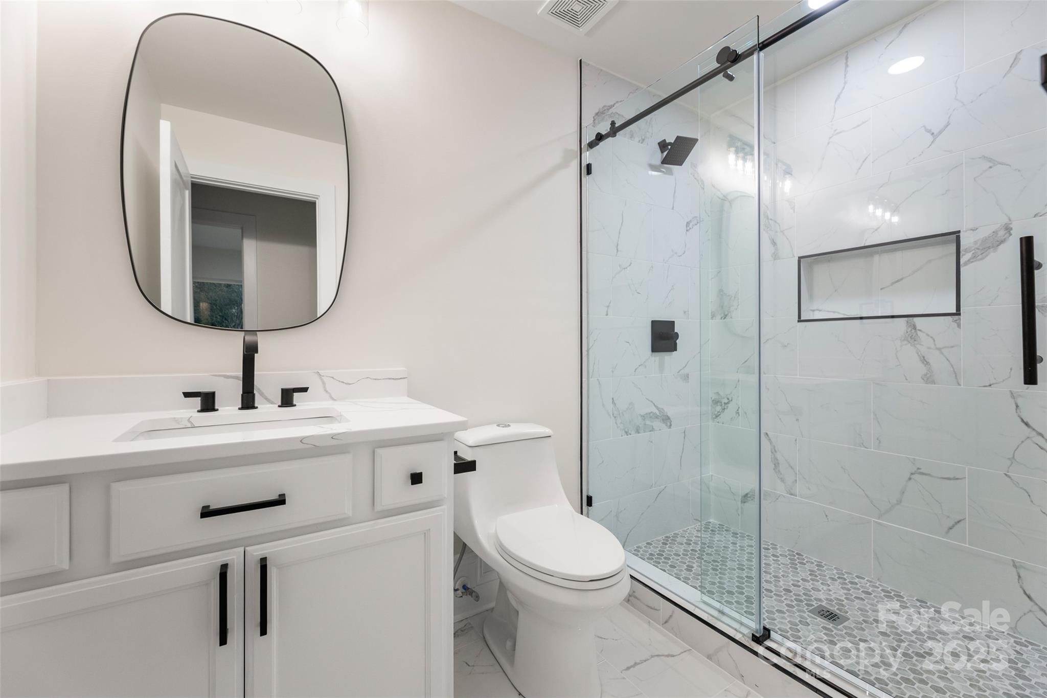 3021 Whitson Road Gastonia, NC 28054 - Photo 27 of 31 a bathroom with a toilet sink and shower