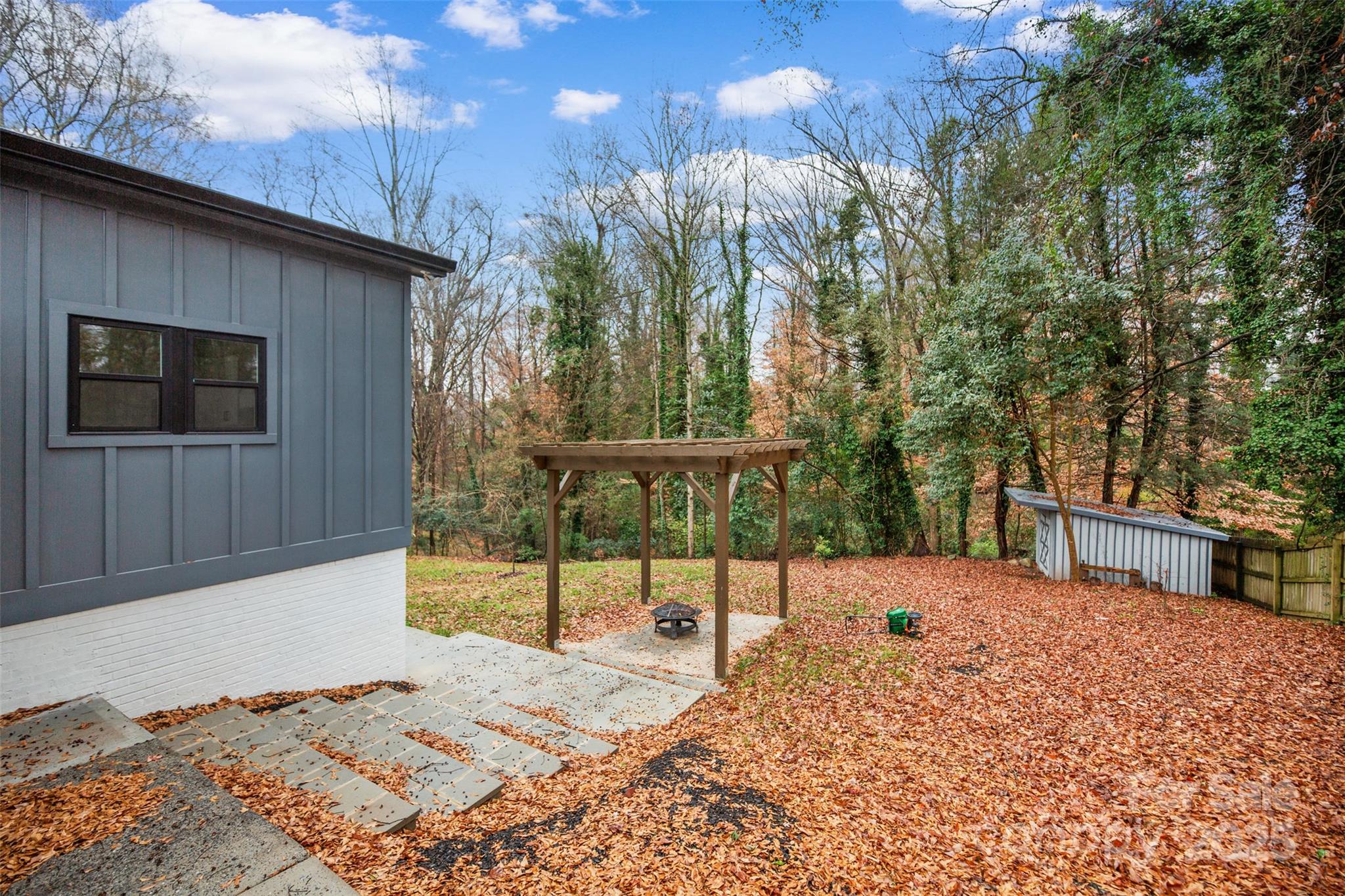 3021 Whitson Road Gastonia, NC 28054 - Photo 29 of 31 a backyard of a house with table and chairs