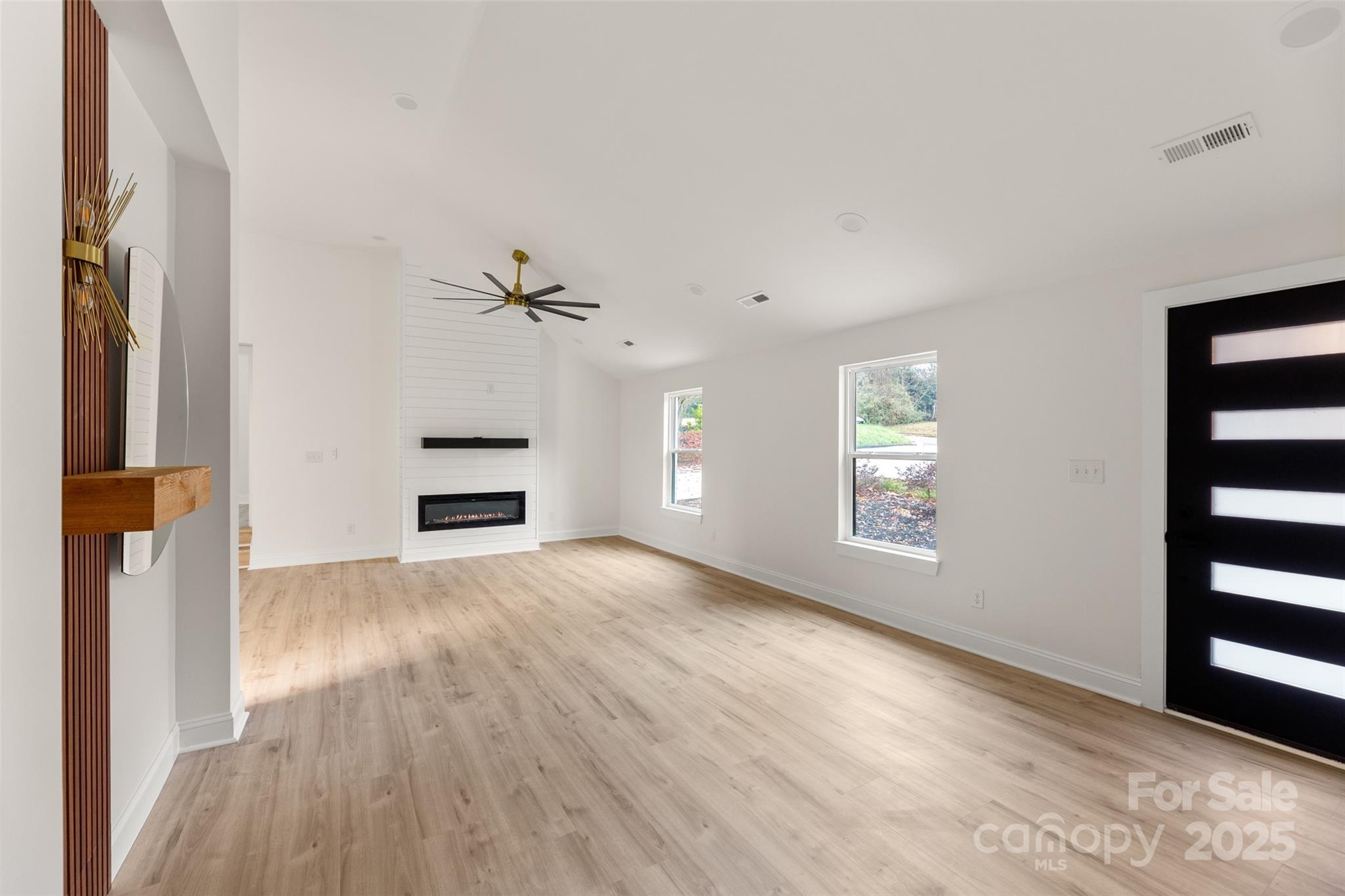 3021 Whitson Road Gastonia, NC 28054 - Photo 5 of 31 a view of an empty room with a window and wooden floor