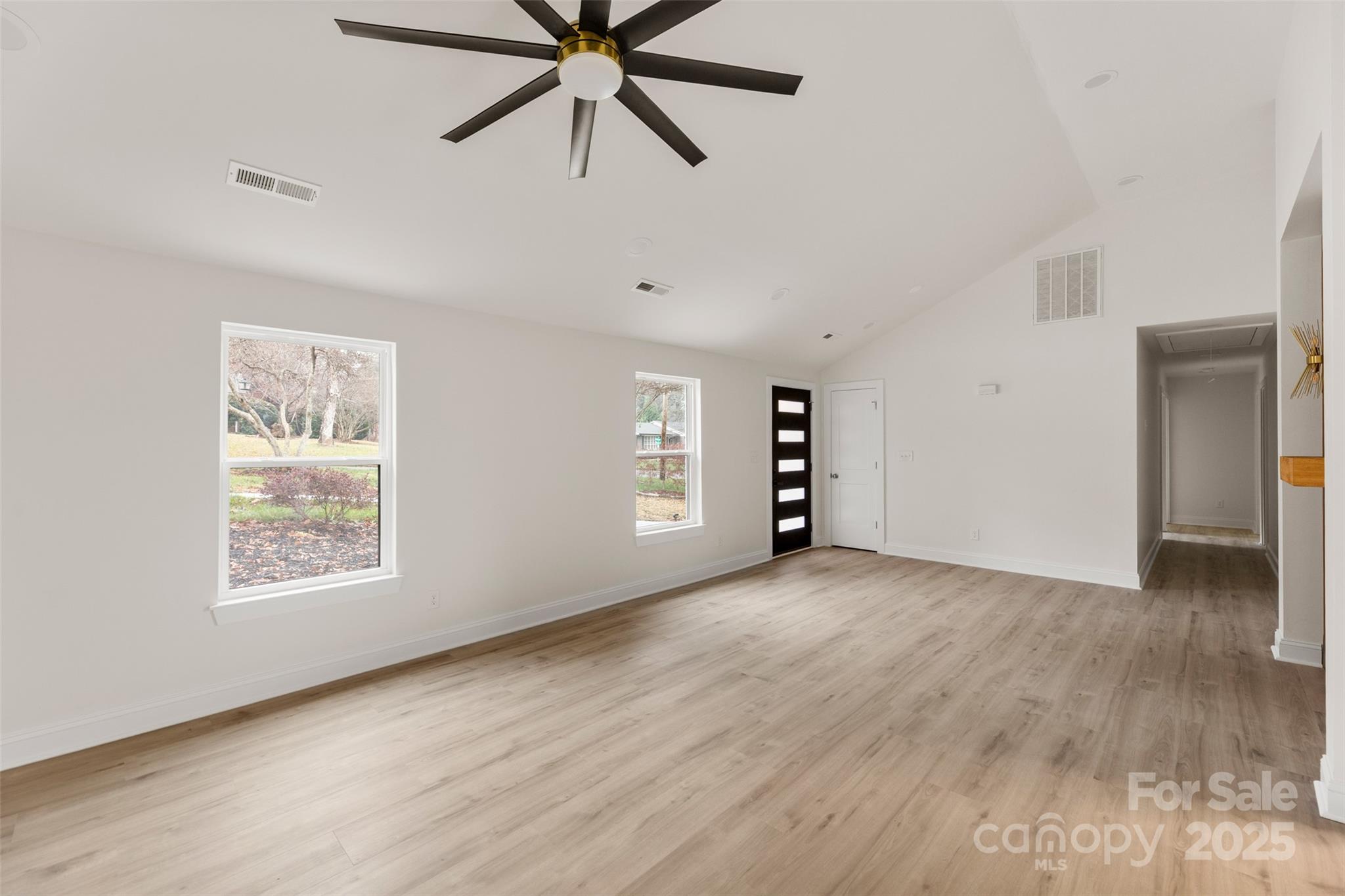 3021 Whitson Road Gastonia, NC 28054 - Photo 6 of 31 an empty room with windows and fan