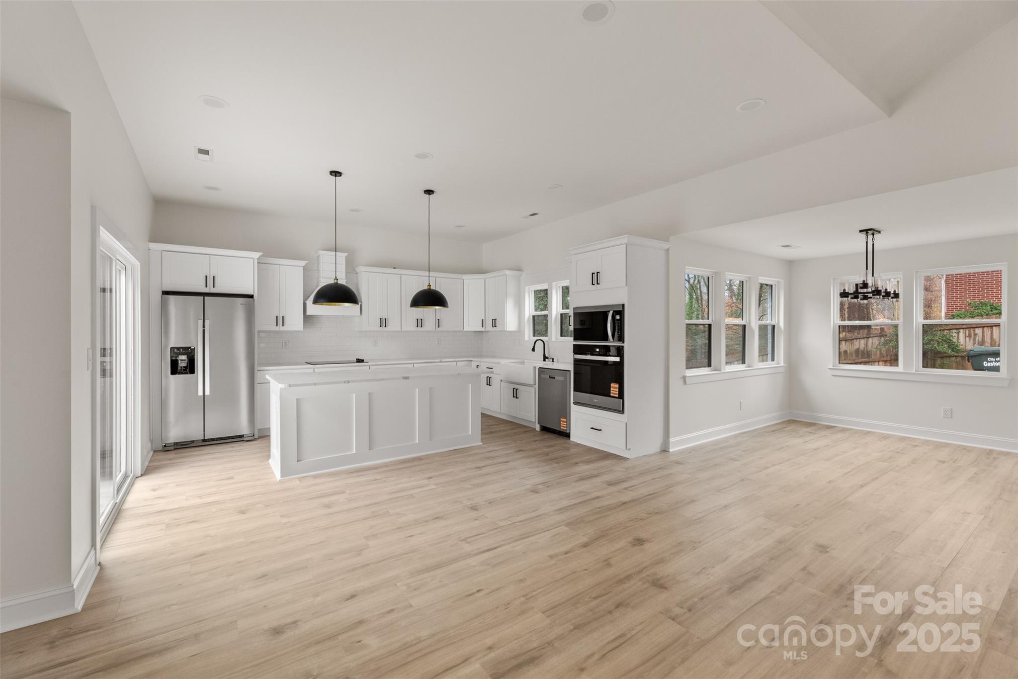 3021 Whitson Road Gastonia, NC 28054 - Photo 8 of 31 a view of a kitchen with white cabinets and white appliances