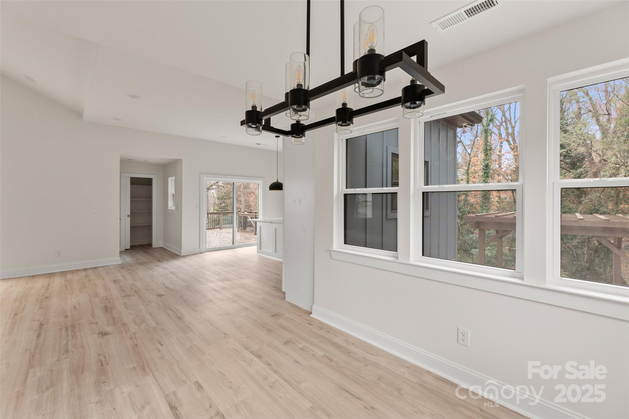 3021 Whitson Road Gastonia, NC 28054 - Photo 10 of 31 a view of an empty room with a window and wooden floor
