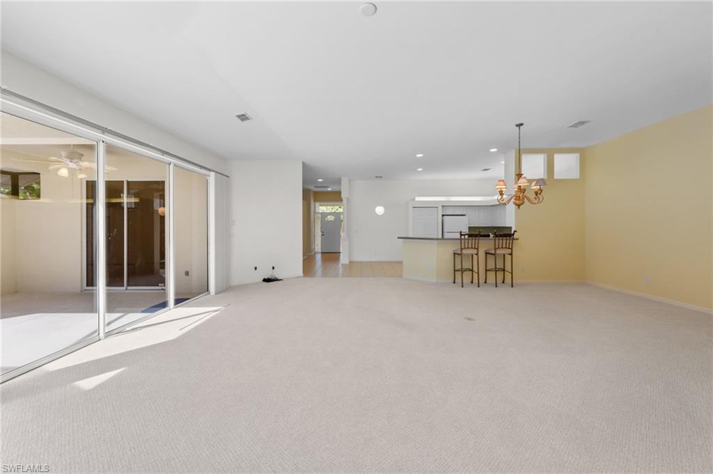 23851 Amalfi Coast Road Estero, FL 34135 - Photo 19 of 49 a view of a livingroom with furniture and a window
