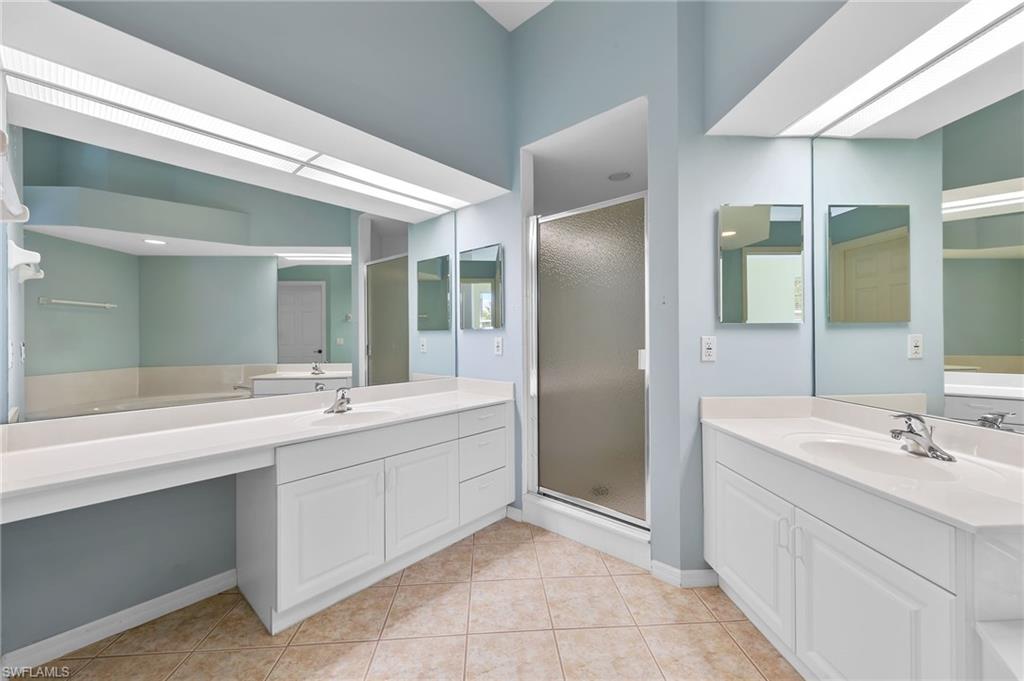 23851 Amalfi Coast Road Estero, FL 34135 - Photo 27 of 49 a bathroom with a double vanity sink mirror and double