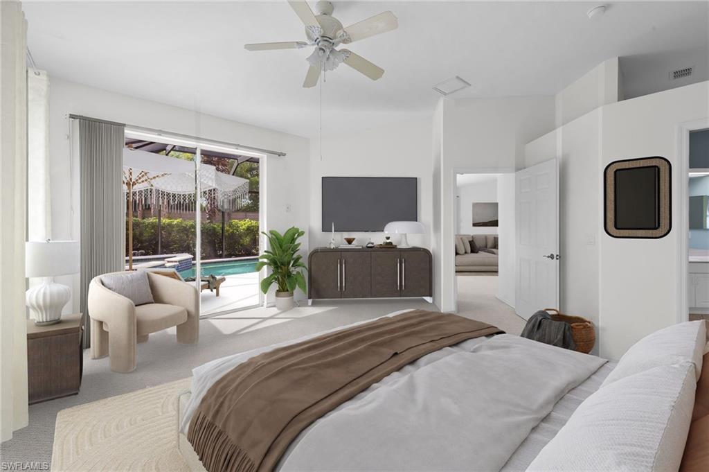 23851 Amalfi Coast Road Estero, FL 34135 - Photo 3 of 49 a bedroom with a bed and a large window