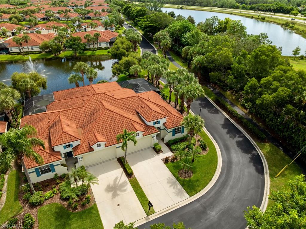 23851 Amalfi Coast Road Estero, FL 34135 - Photo 43 of 49 an aerial view of a house with outdoor space and lake view
