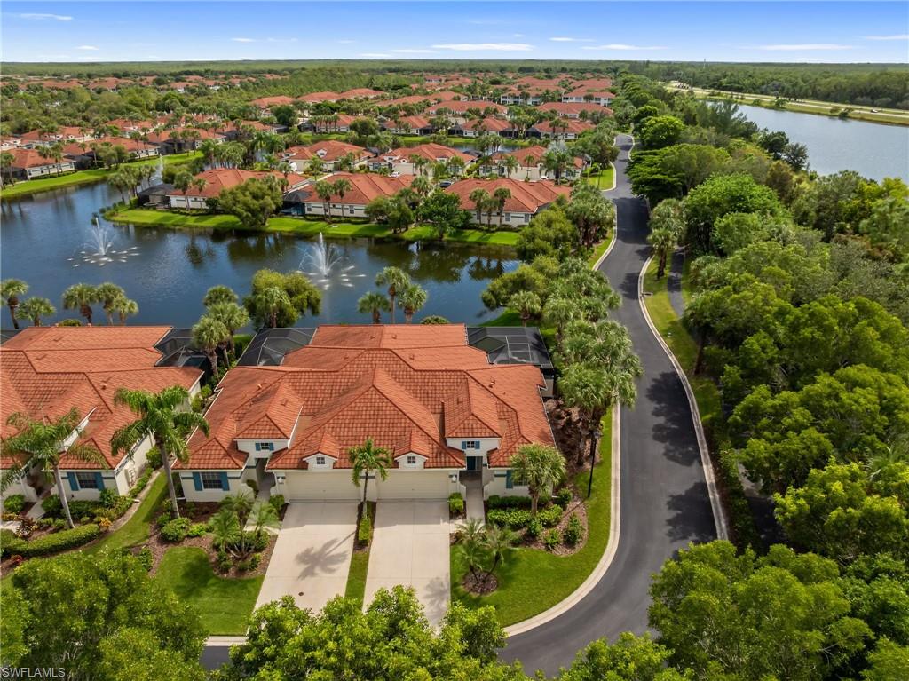 23851 Amalfi Coast Road Estero, FL 34135 - Photo 44 of 49 an aerial view of a house with a lake view