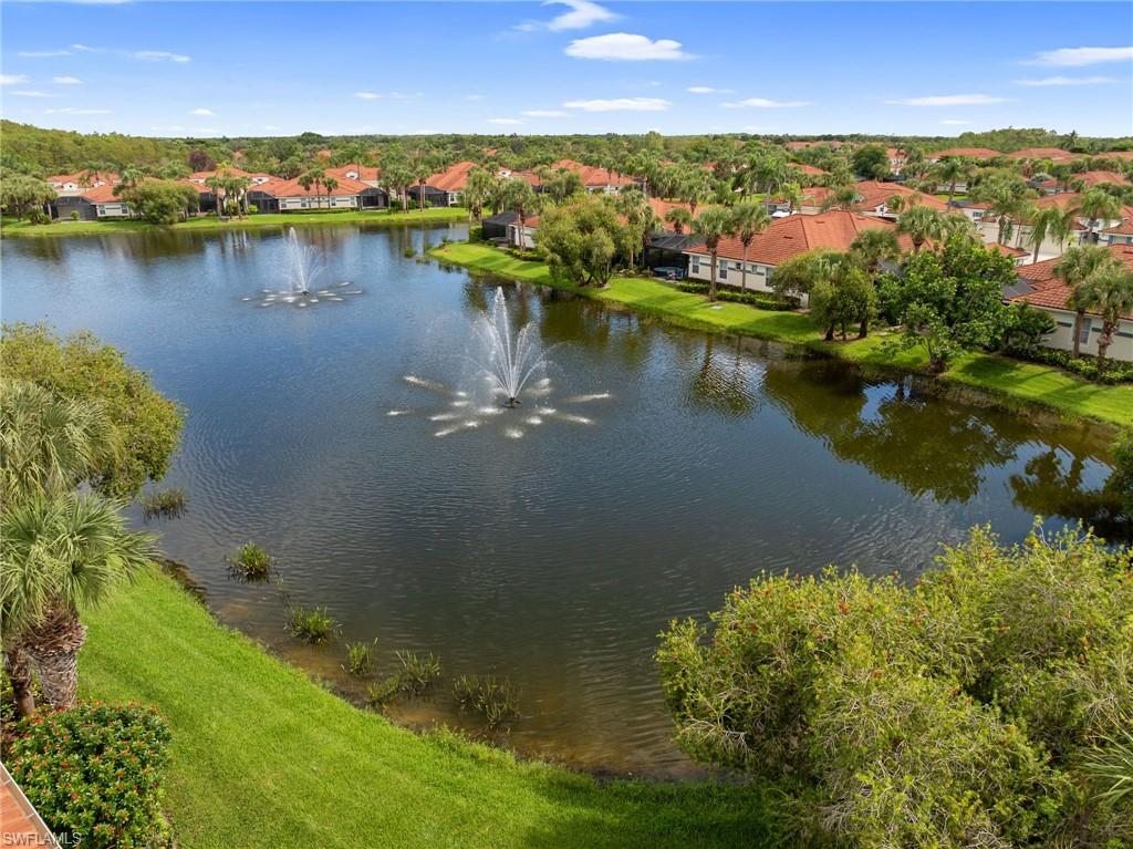 23851 Amalfi Coast Road Estero, FL 34135 - Photo 47 of 49 a view of a lake with a city