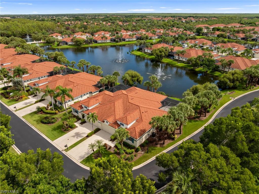 23851 Amalfi Coast Road Estero, FL 34135 - Photo 5 of 49 an aerial view of residential houses with outdoor space and river