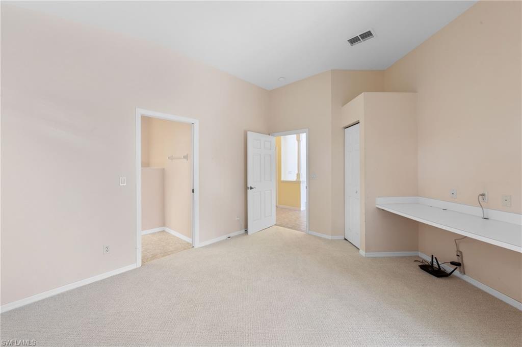 23851 Amalfi Coast Road Estero, FL 34135 - Photo 9 of 49 a view of an empty room with a window