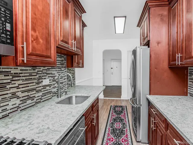 a kitchen with sink cabinets and outdoor view