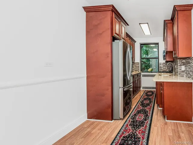 a view of a kitchen from the hallway
