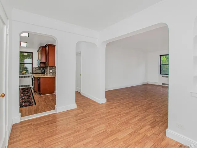 a view of a kitchen cabinets and wooden floor