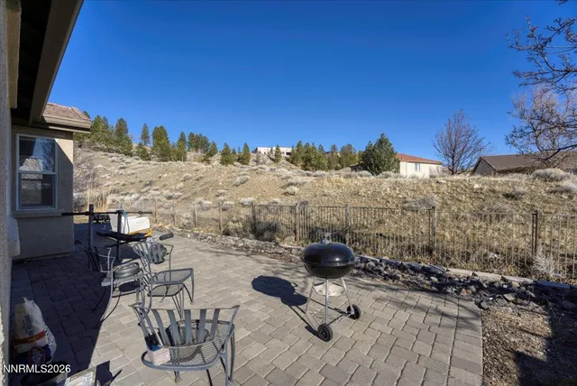 a view of a terrace with furniture and a table