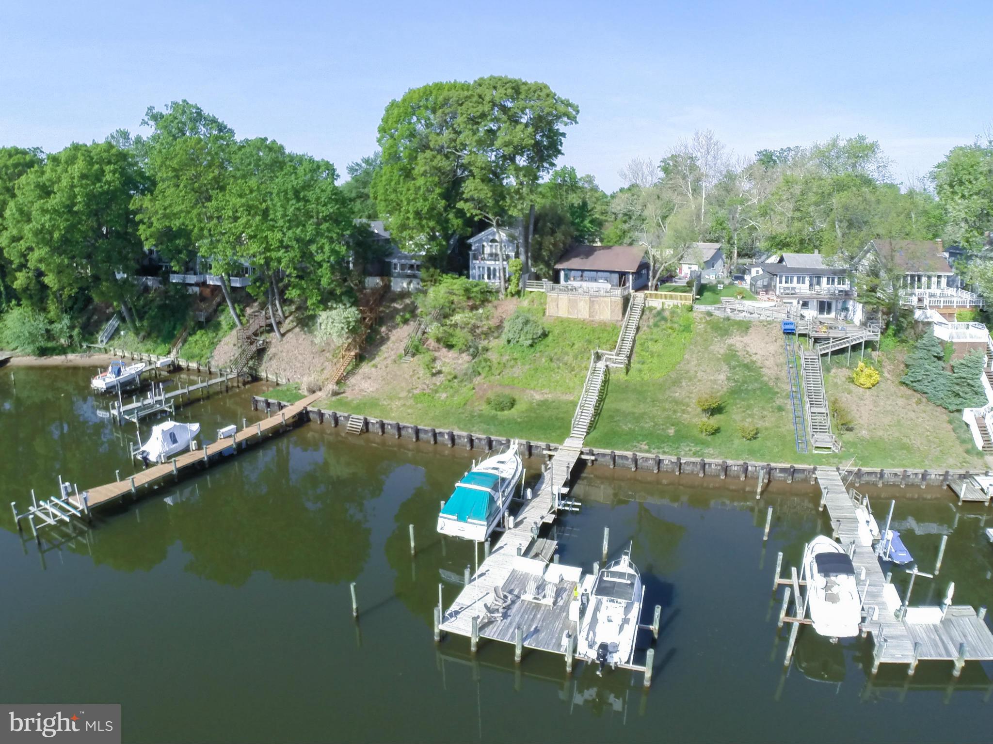 100 Ridge Road Riva, MD 21140 - Photo 2 of 29 a view of a lake with a house