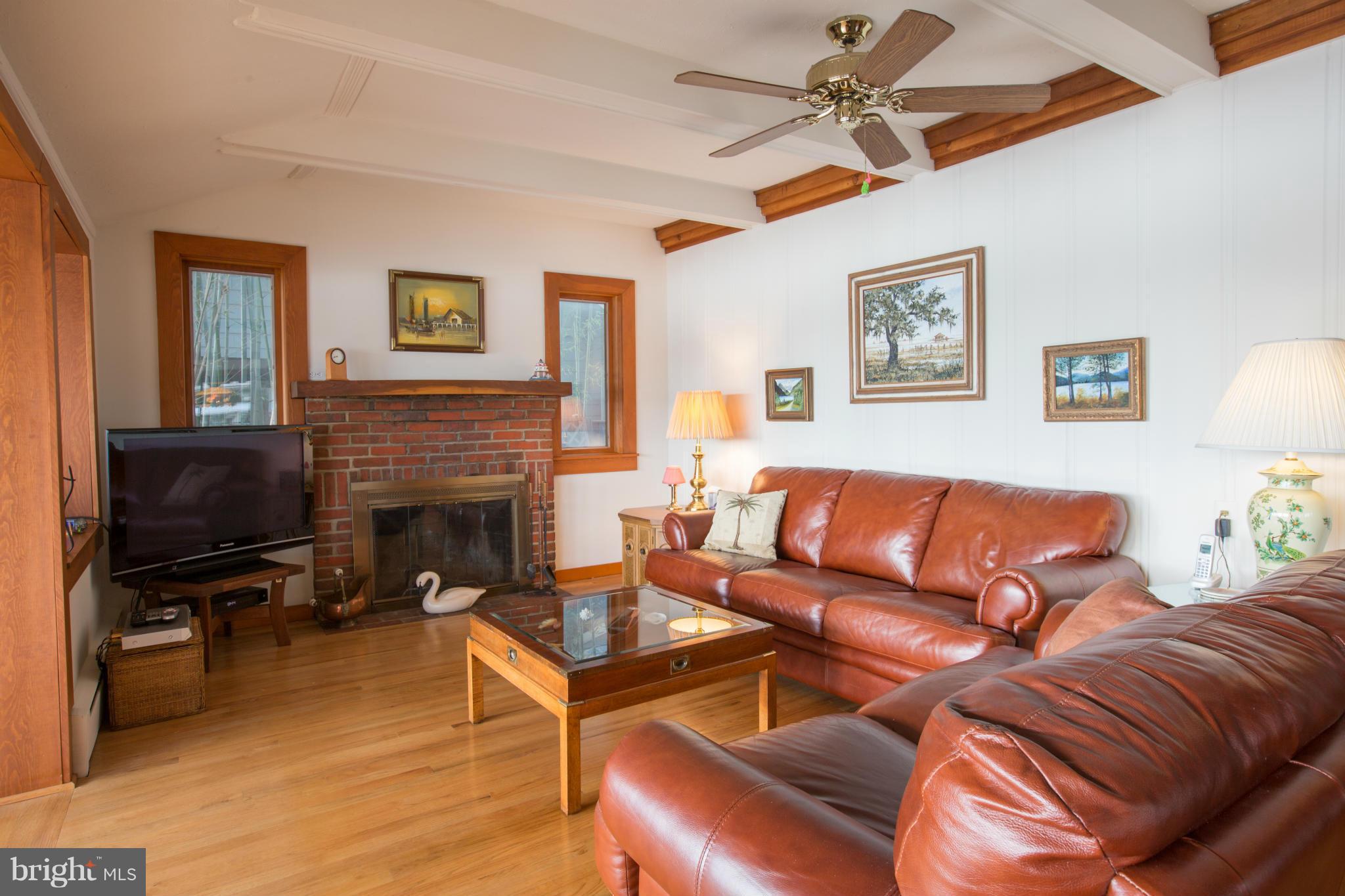 100 Ridge Road Riva, MD 21140 - Photo 18 of 29 a living room with furniture a flat screen tv and a fireplace