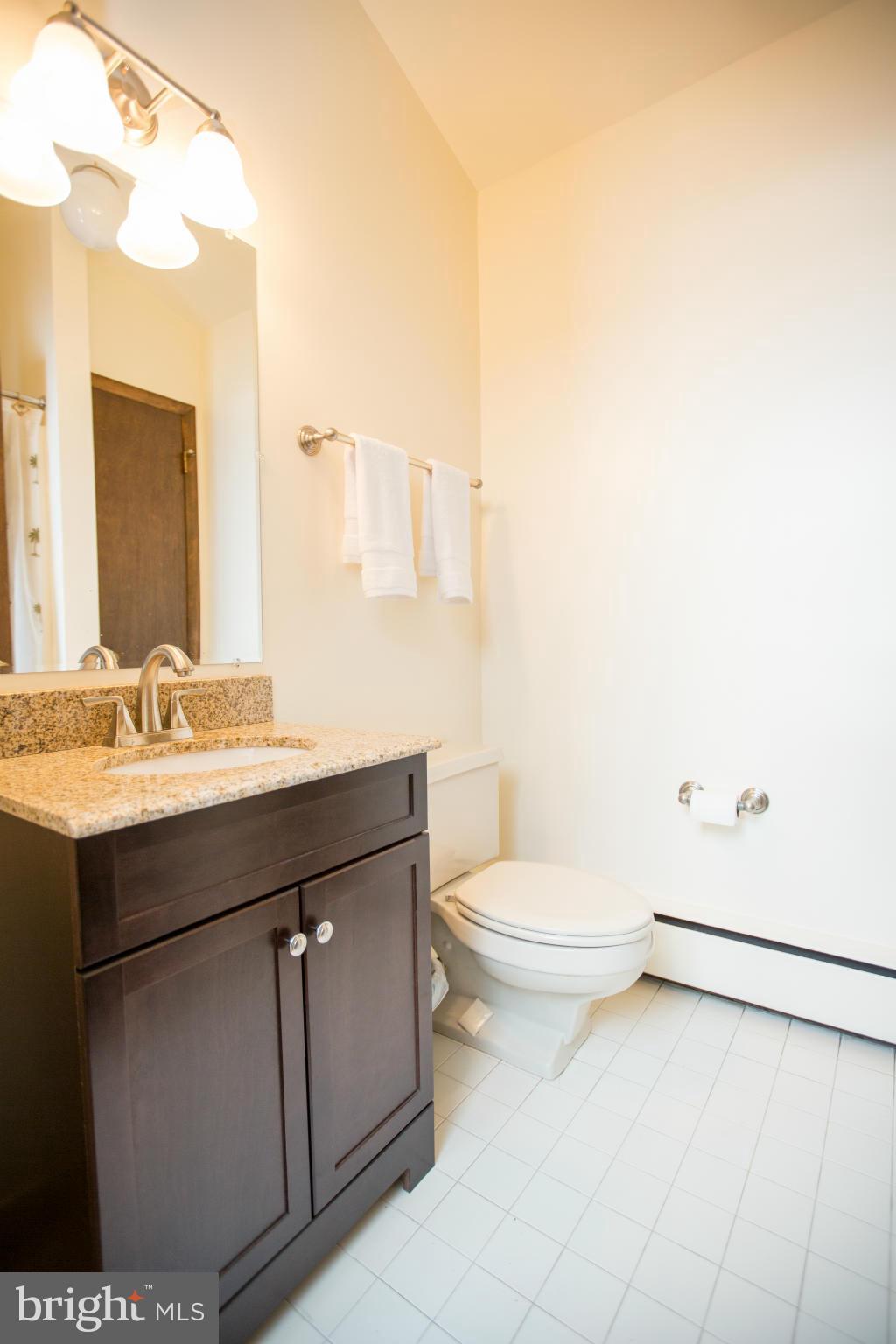 100 Ridge Road Riva, MD 21140 - Photo 21 of 29 a bathroom with a sink a toilet and mirror
