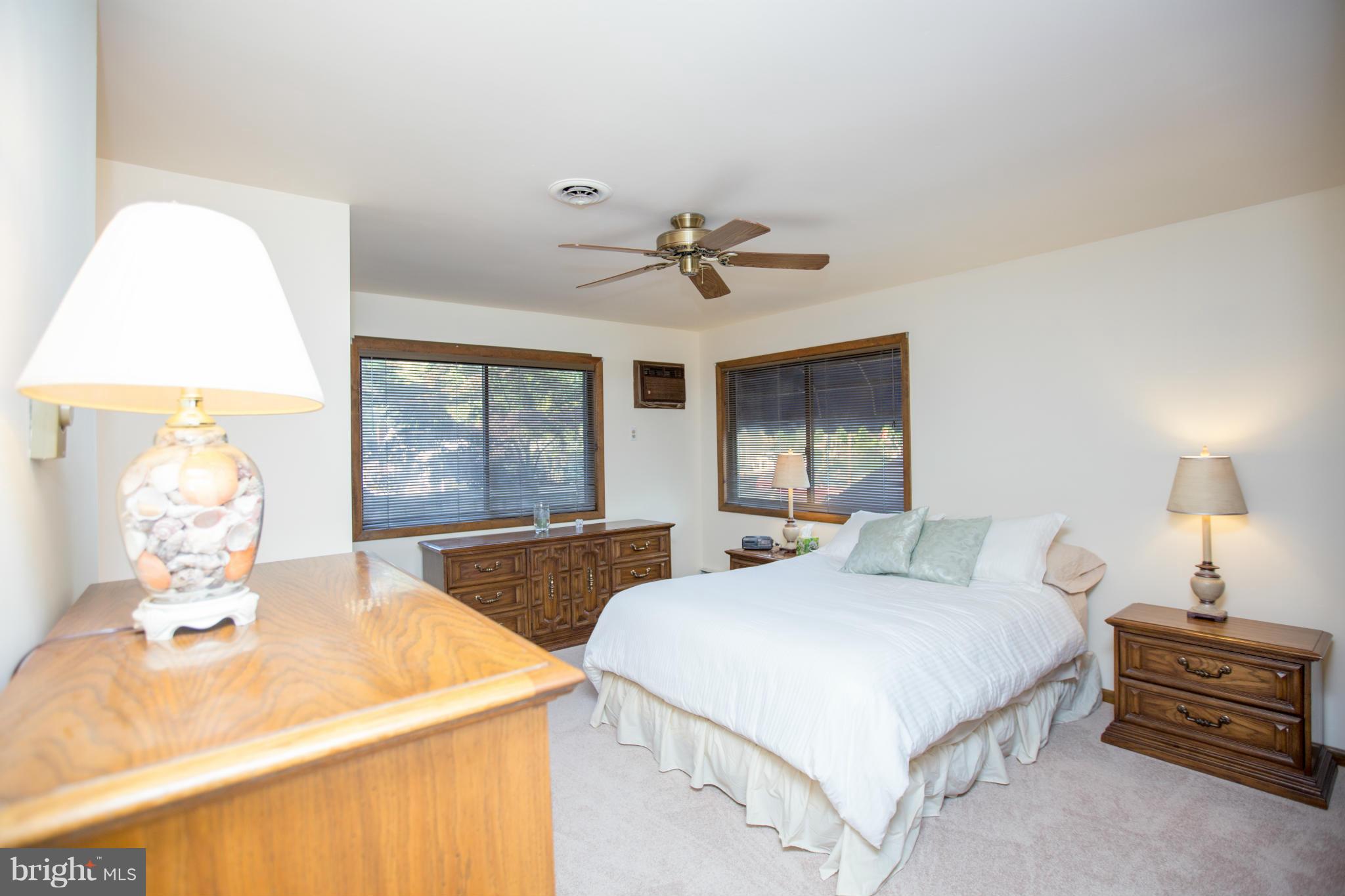 100 Ridge Road Riva, MD 21140 - Photo 23 of 29 a bedroom with a bed and a chandelier