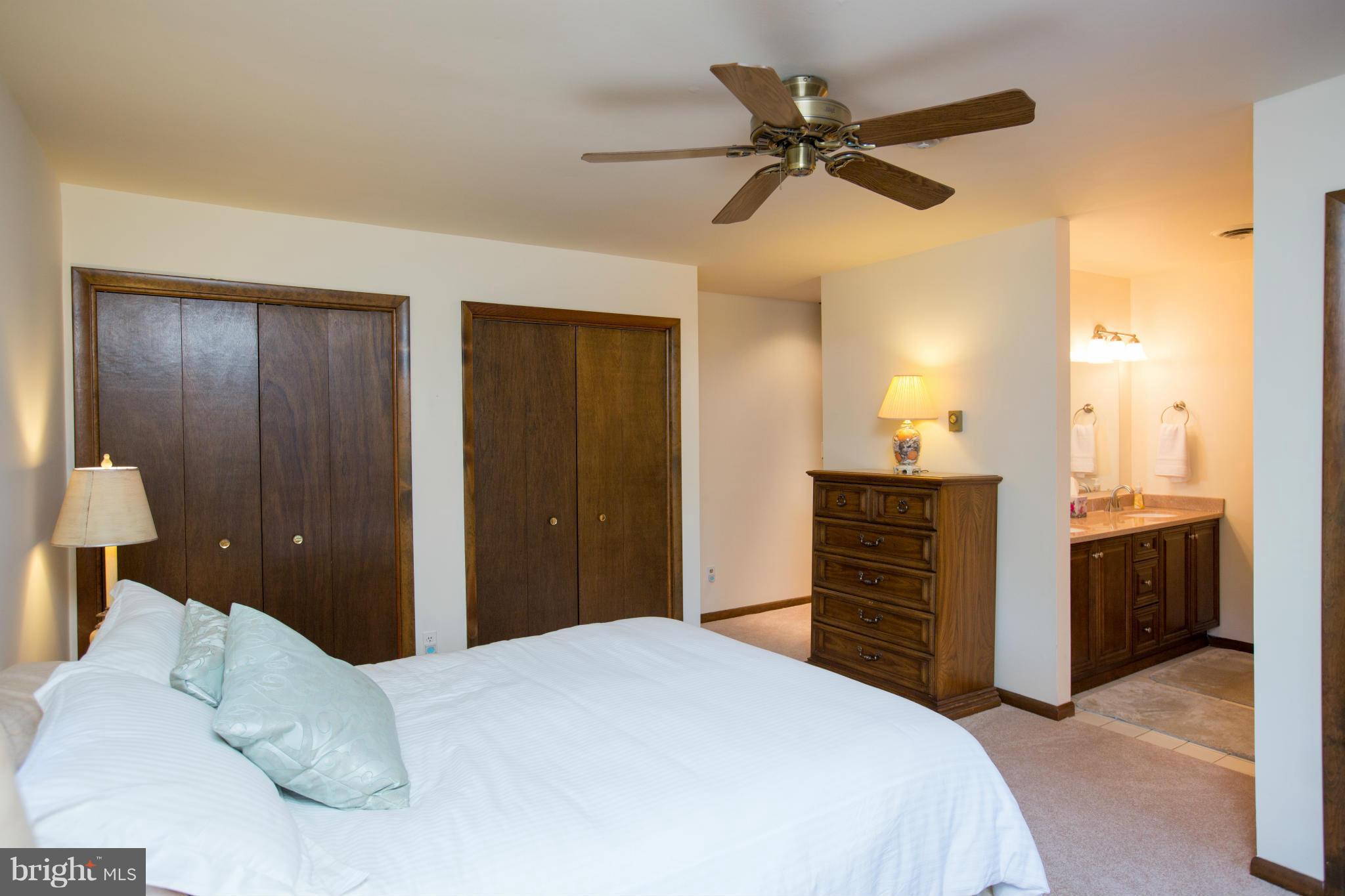 100 Ridge Road Riva, MD 21140 - Photo 24 of 29 a bedroom with a bed and a chandelier