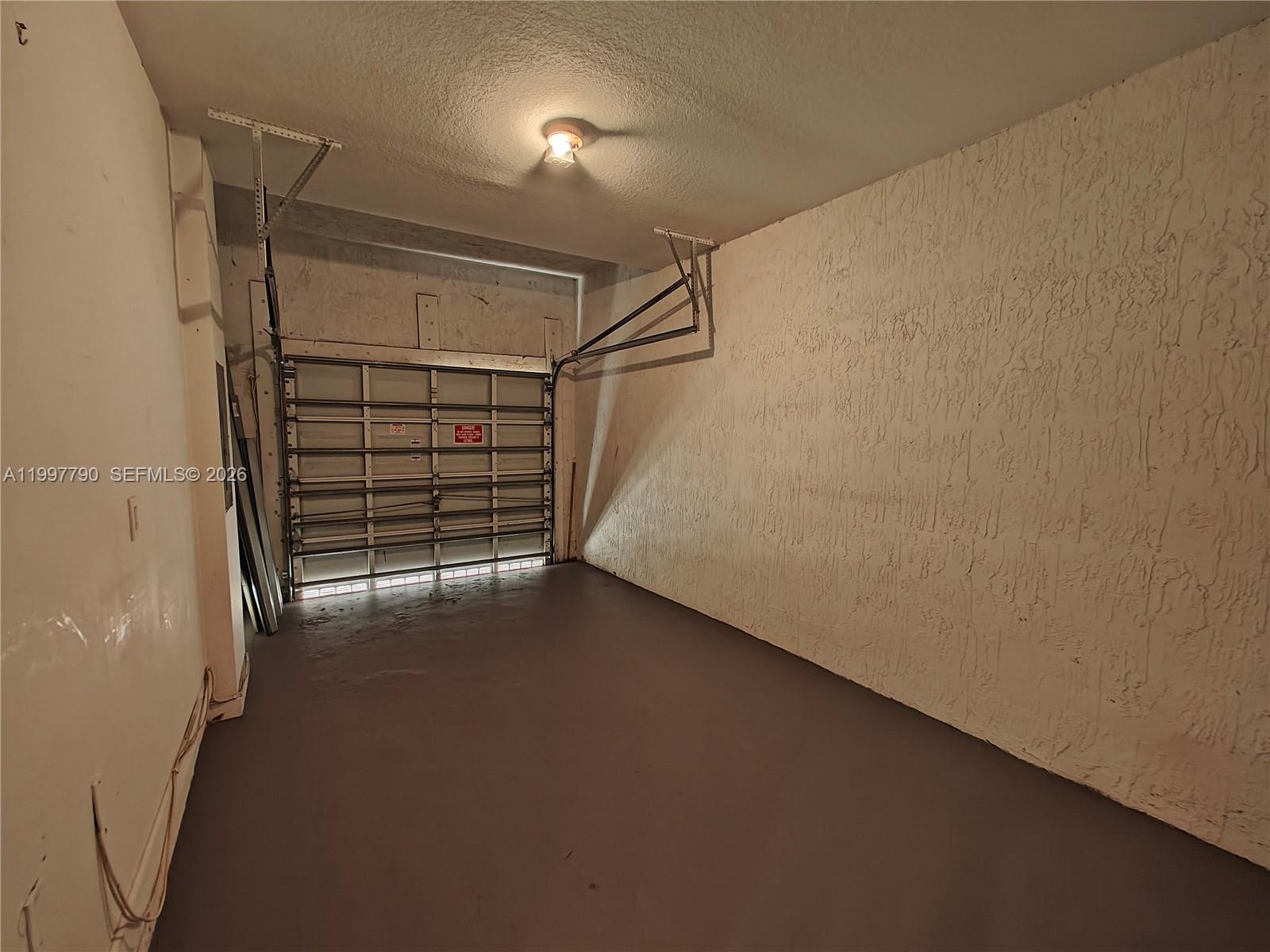 11252 Southwest 230th Terrace, Unit 11252 Miami, FL 33170 - Photo 26 of 28 a view of walk in closet with empty racks