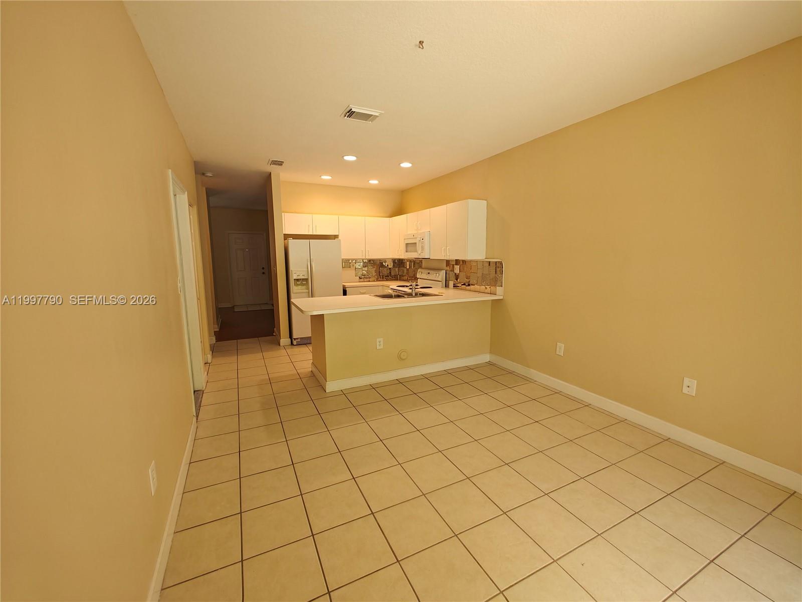 11252 Southwest 230th Terrace, Unit 11252 Miami, FL 33170 - Photo 6 of 28 a view of a kitchen with a sink