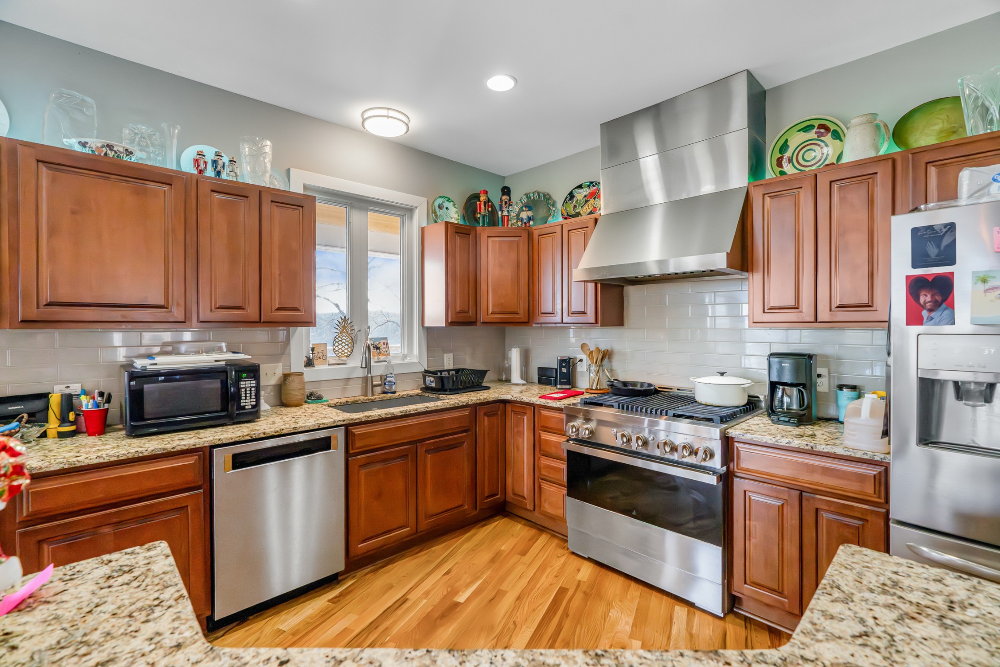 1290 Stillhouse Branch Road Sparta, TN 38583 - Photo 18 of 51 a kitchen with kitchen island granite countertop a sink cabinets and stainless steel appliances