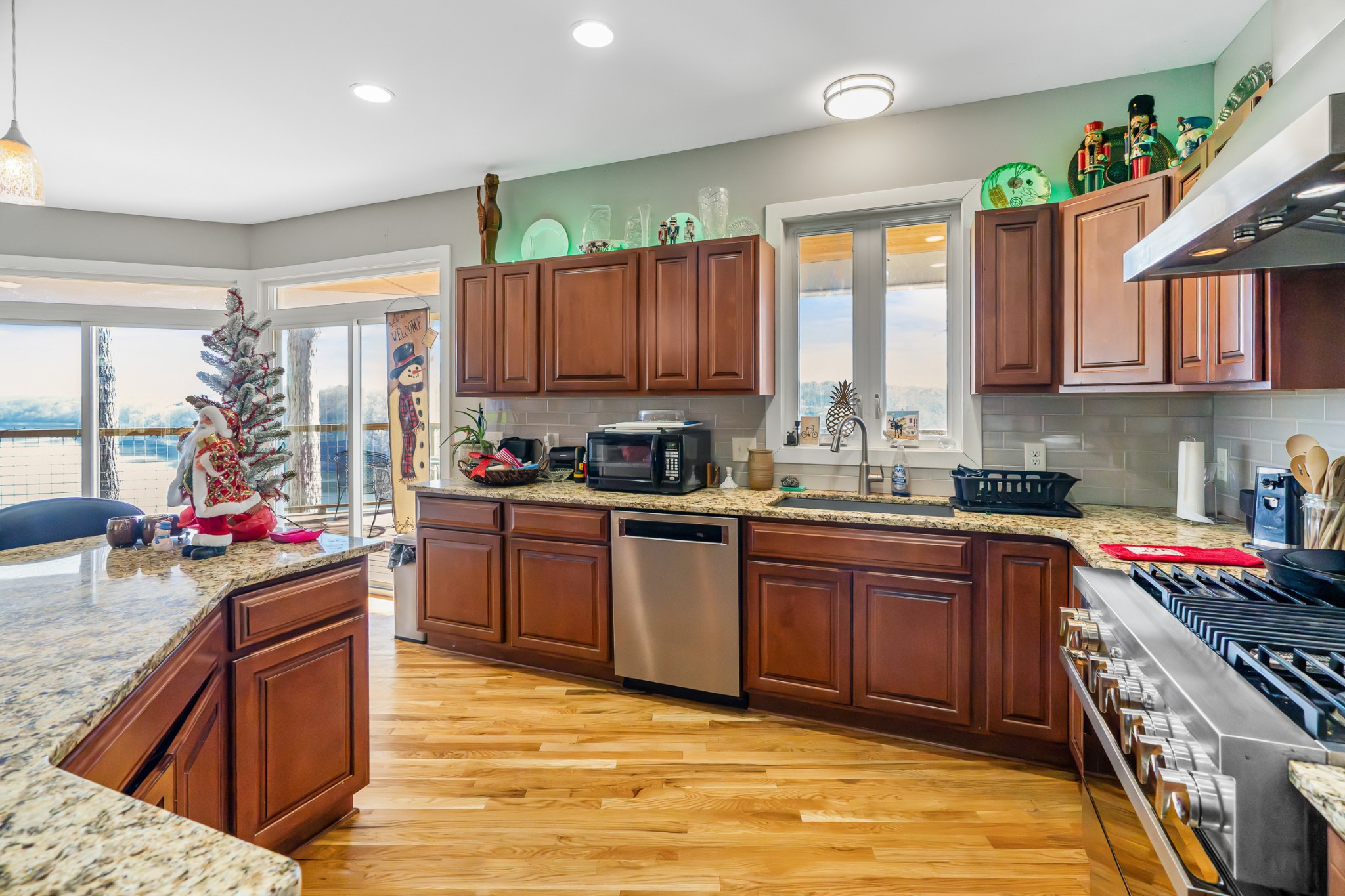 1290 Stillhouse Branch Road Sparta, TN 38583 - Photo 20 of 51 a kitchen with stainless steel appliances granite countertop a stove sink and cabinets