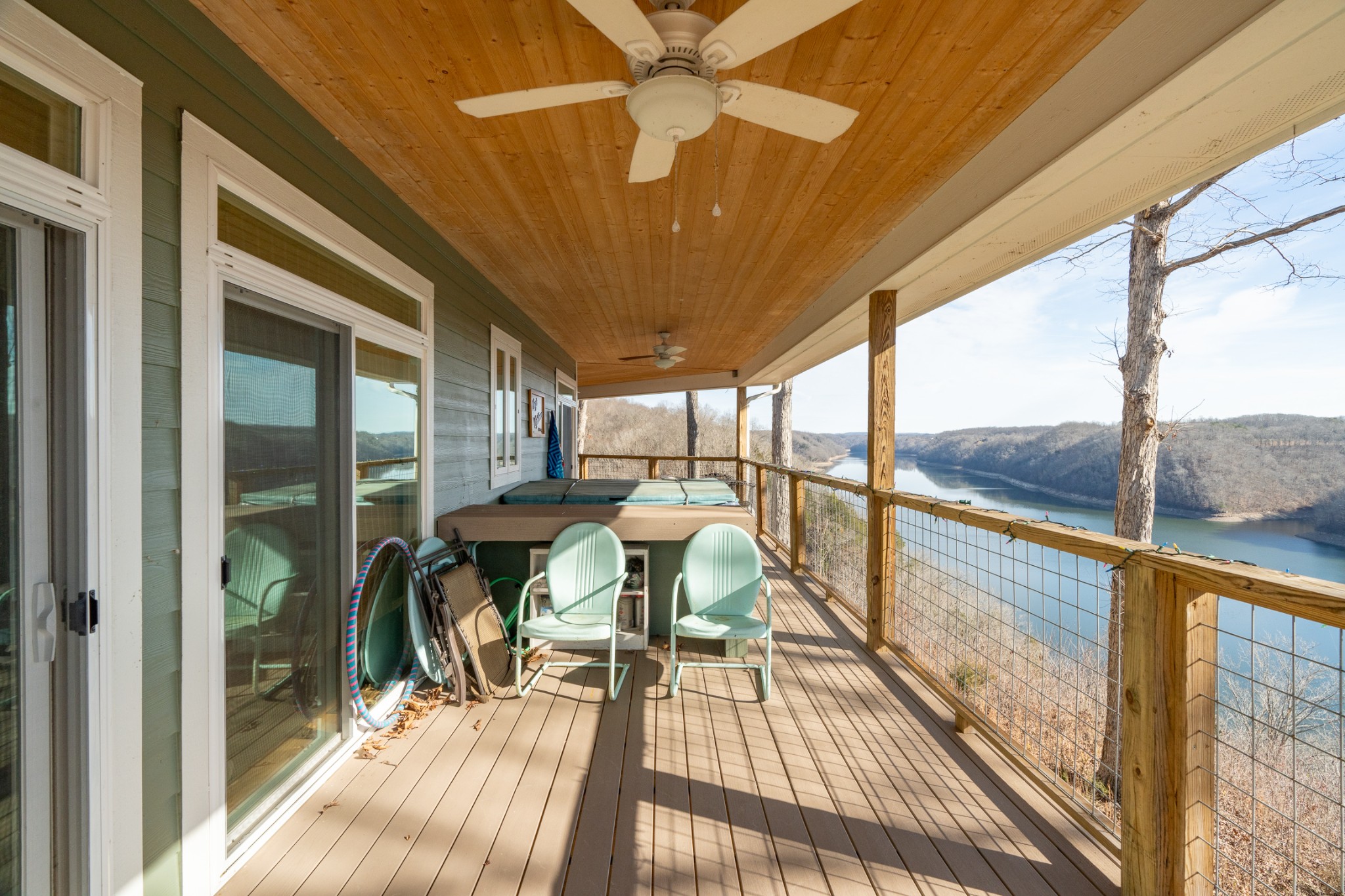 1290 Stillhouse Branch Road Sparta, TN 38583 - Photo 5 of 51 a view of a balcony with chairs and wooden floor