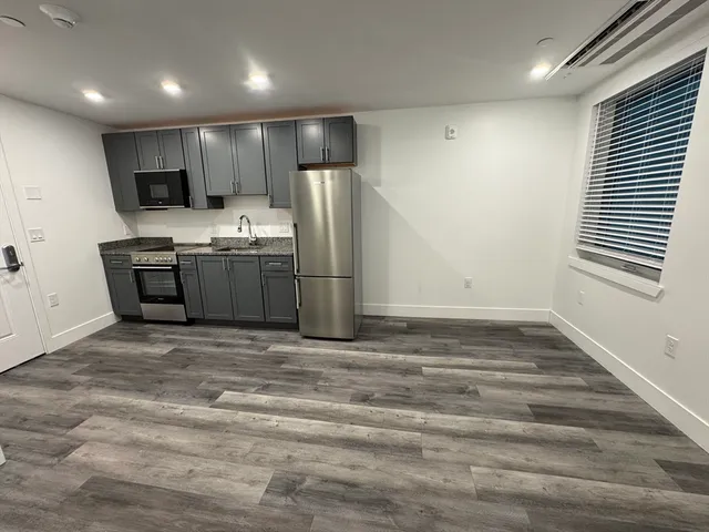 a view of a kitchen with a sink