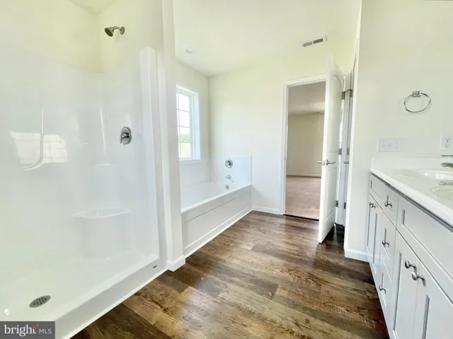 a bathroom with a bathtub and a shower