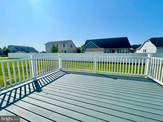 a view of a street with wooden deck