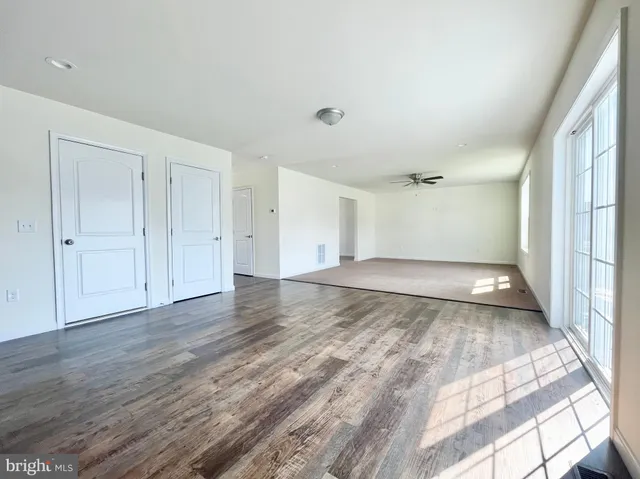 a view of a livingroom with wooden floor