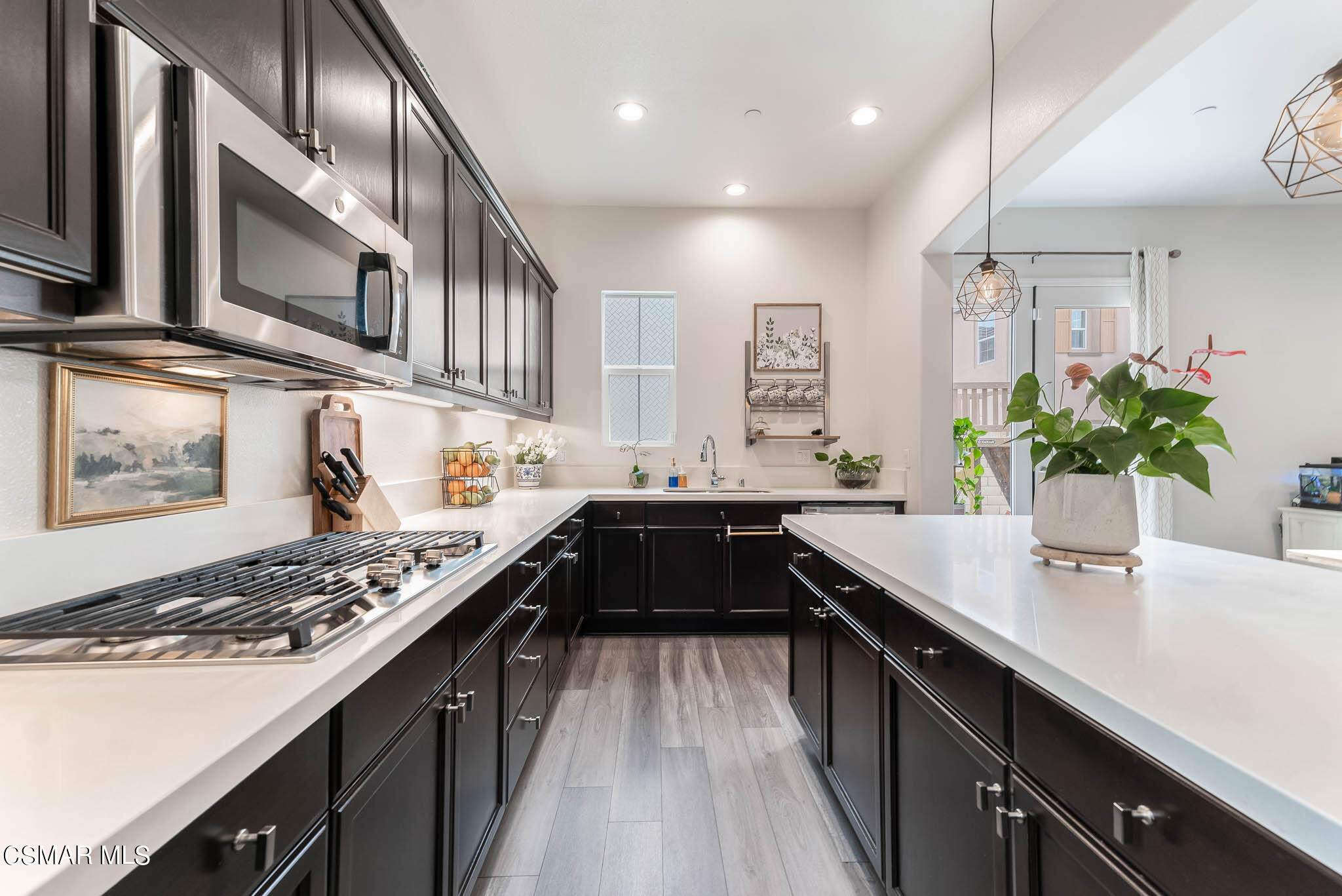 1622 Range Road Oxnard, CA 93036 - Photo 25 of 50 a kitchen with stainless steel appliances kitchen island granite countertop a sink stove and cabinets