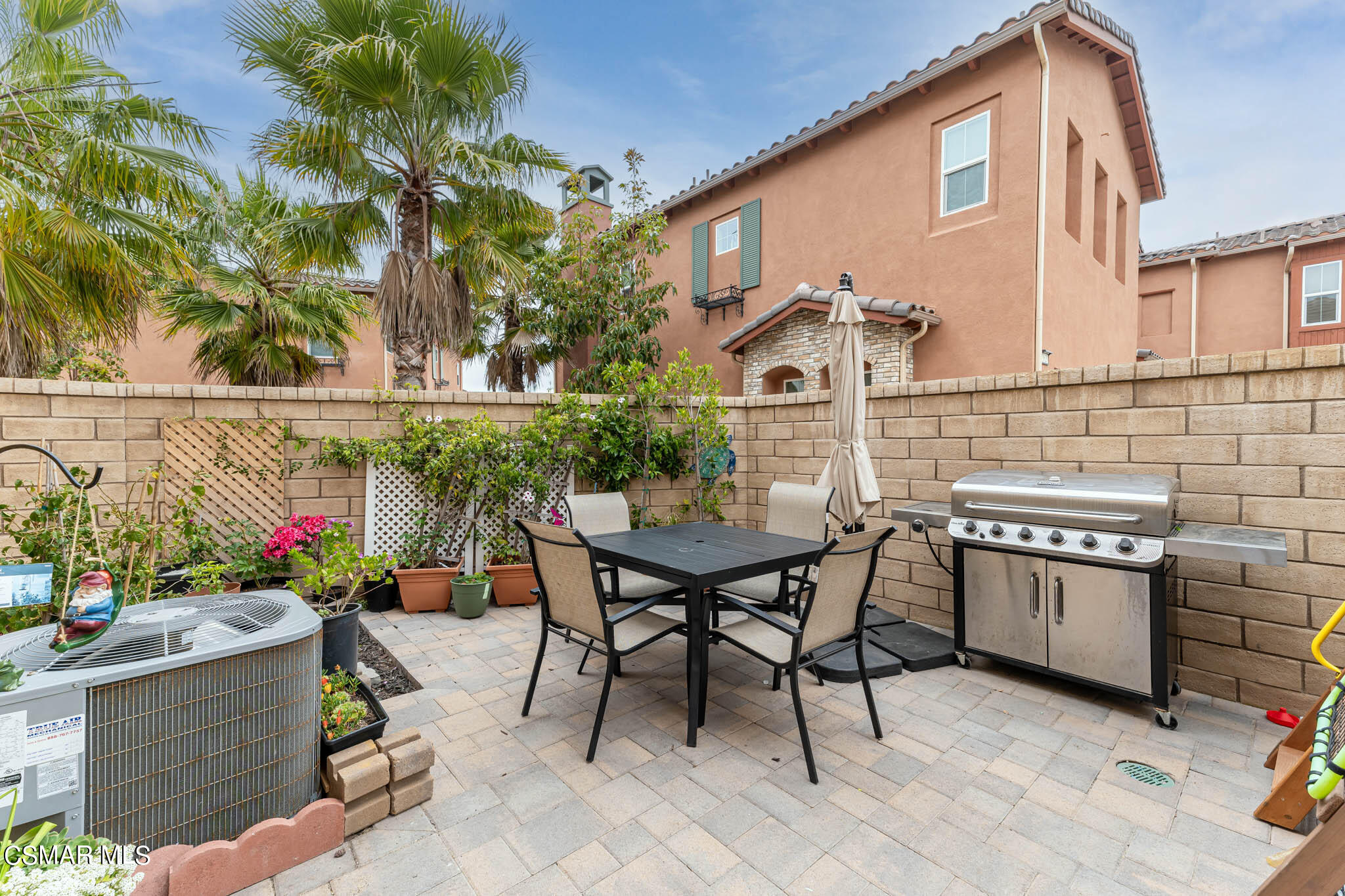 1622 Range Road Oxnard, CA 93036 - Photo 45 of 50 a view of a patio with table and chairs and potted plants