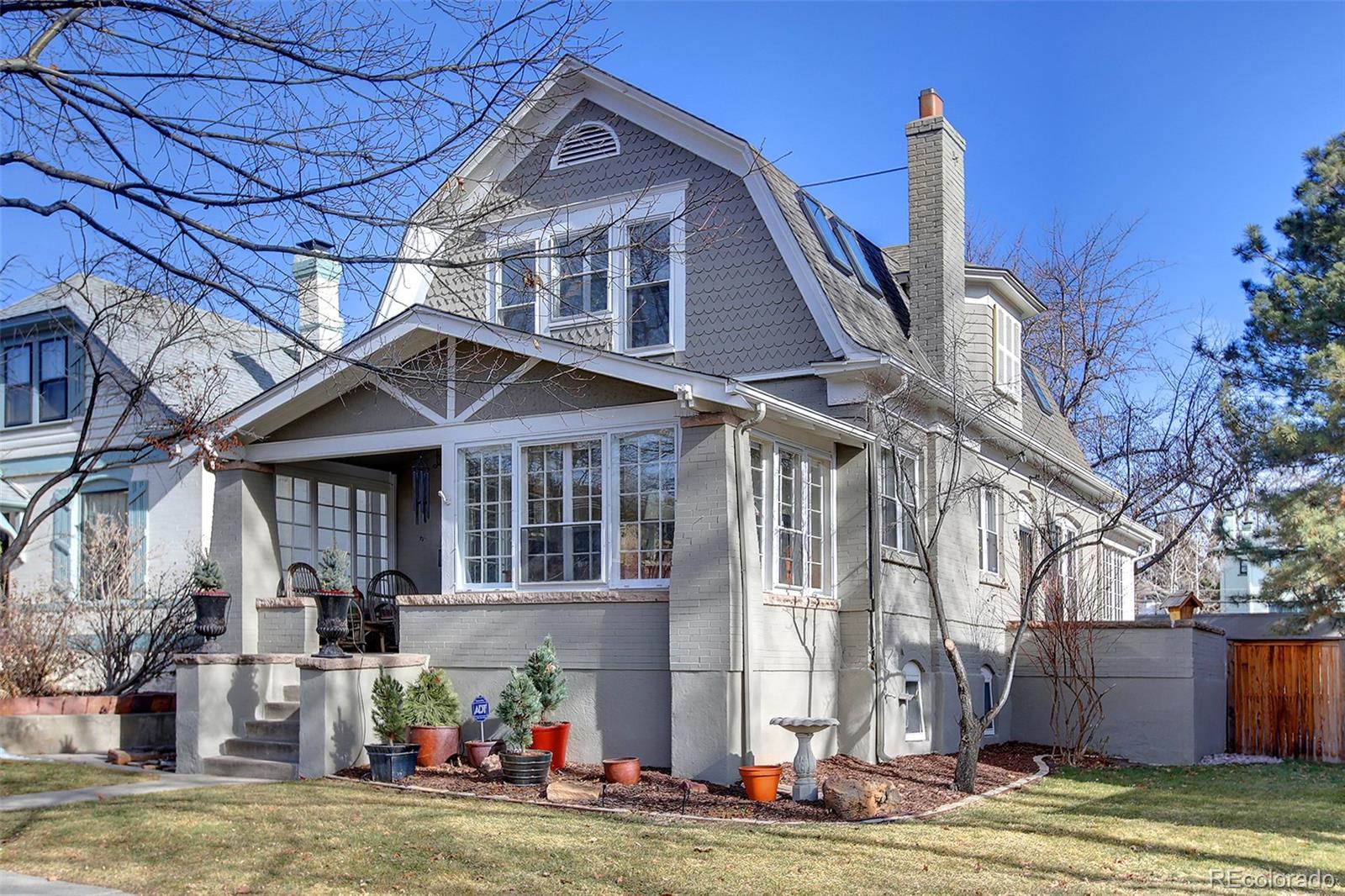 570 Gilpin Street Denver, CO 80218 - Photo 1 of 30 a front view of a house with a garden