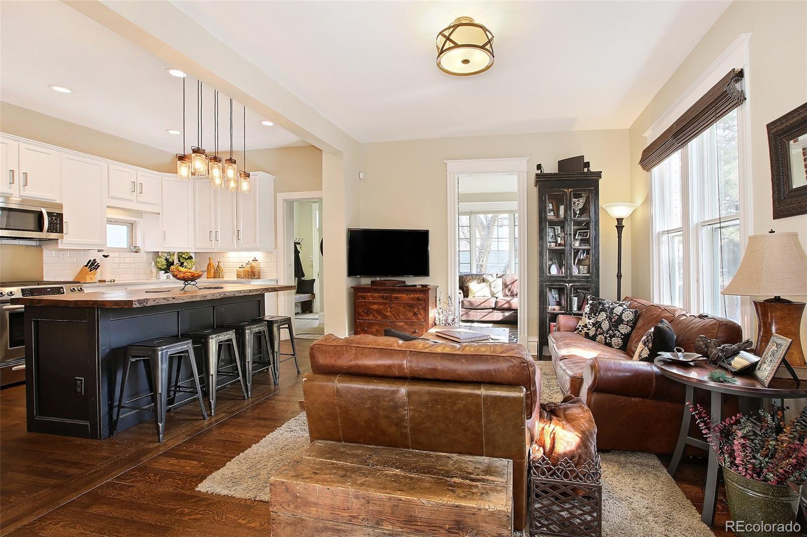570 Gilpin Street Denver, CO 80218 - Photo 13 of 30 a living room with furniture and a flat screen tv