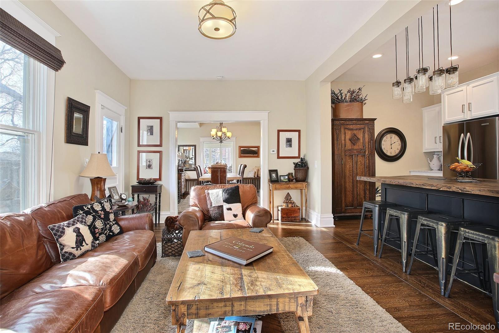570 Gilpin Street Denver, CO 80218 - Photo 14 of 30 a living room with furniture and a clock