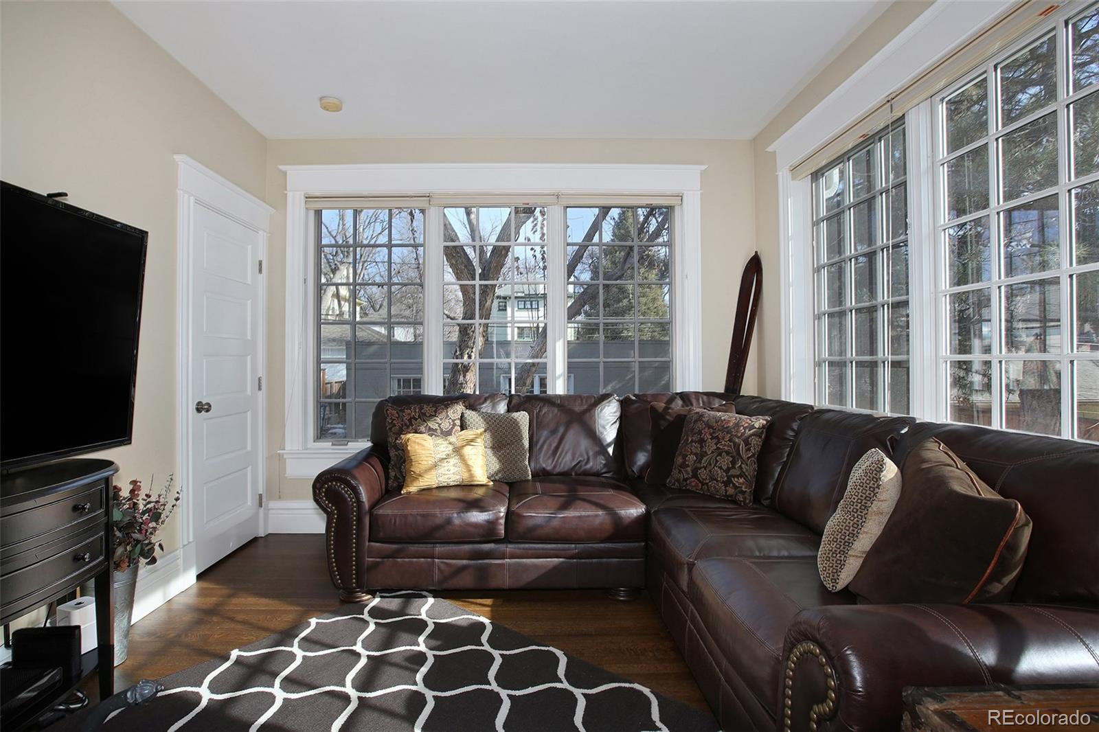 570 Gilpin Street Denver, CO 80218 - Photo 15 of 30 a living room with furniture and a flat screen tv