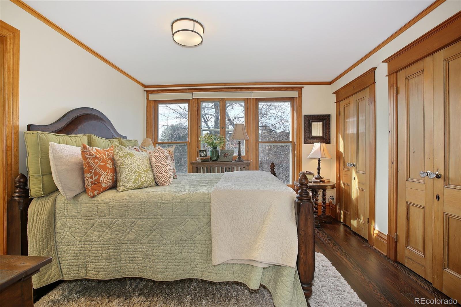 570 Gilpin Street Denver, CO 80218 - Photo 16 of 30 a living room with a bed furniture and a window