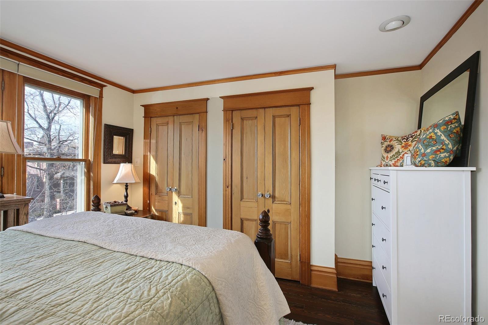 570 Gilpin Street Denver, CO 80218 - Photo 17 of 30 a bedroom with a bed and a large window