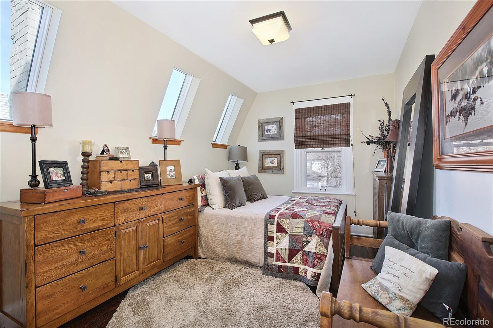 570 Gilpin Street Denver, CO 80218 - Photo 19 of 30 a bedroom with furniture and a flat screen tv