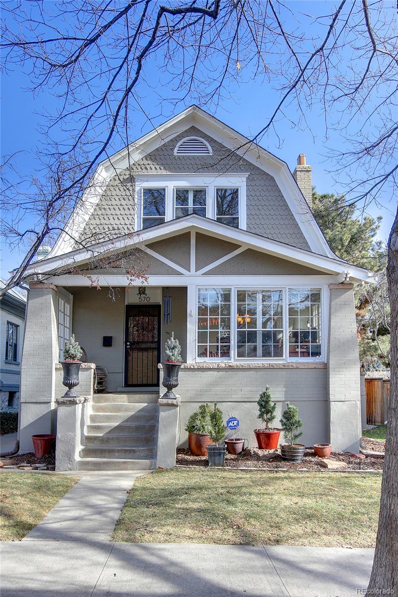 570 Gilpin Street Denver, CO 80218 - Photo 2 of 30 a front view of a house with garden