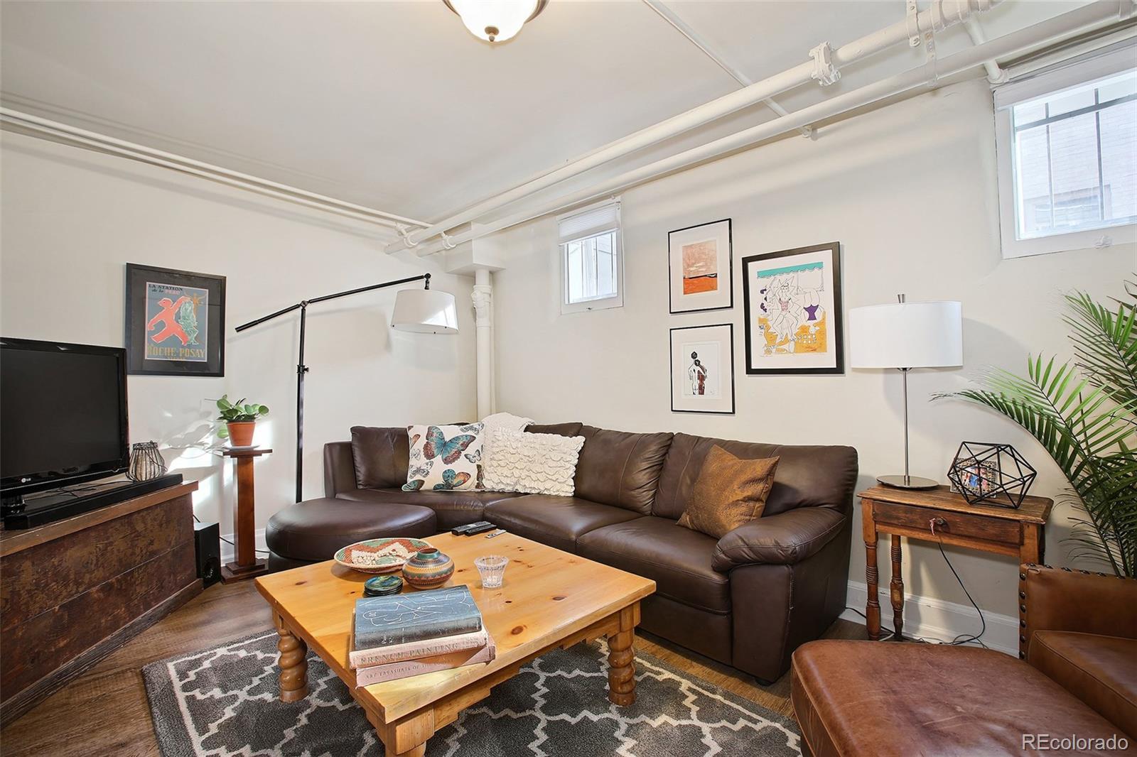570 Gilpin Street Denver, CO 80218 - Photo 24 of 30 a living room with furniture and a flat screen tv
