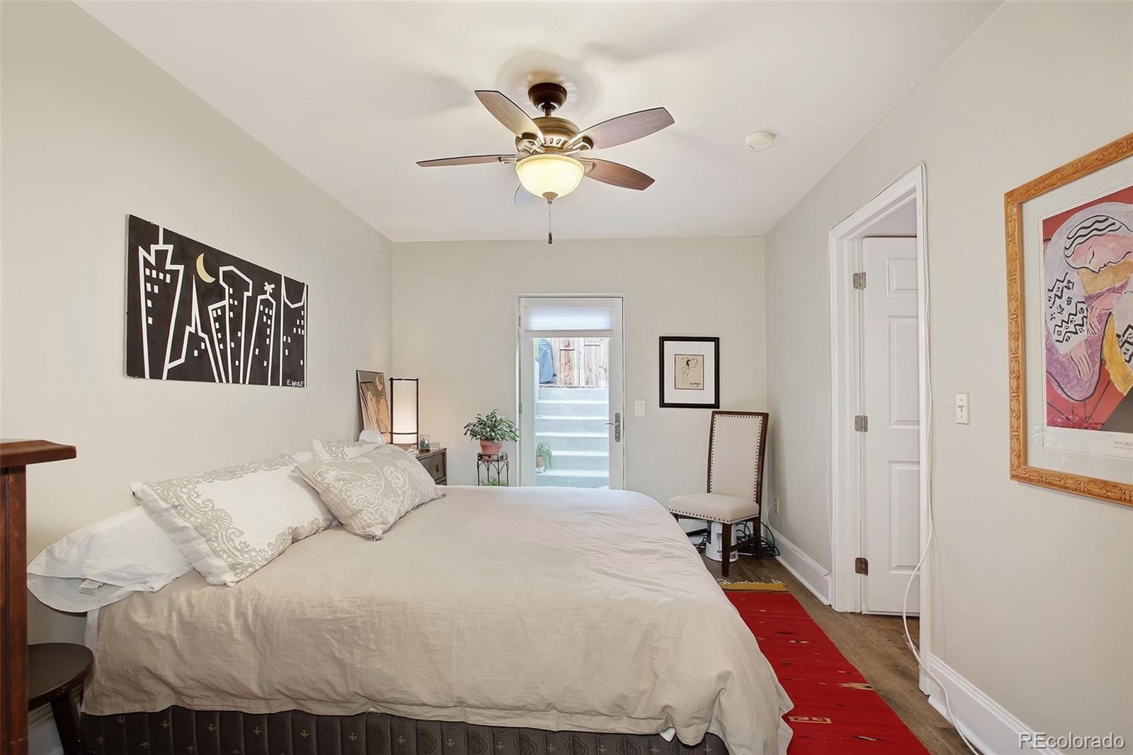 570 Gilpin Street Denver, CO 80218 - Photo 26 of 30 a bedroom with a bed and window