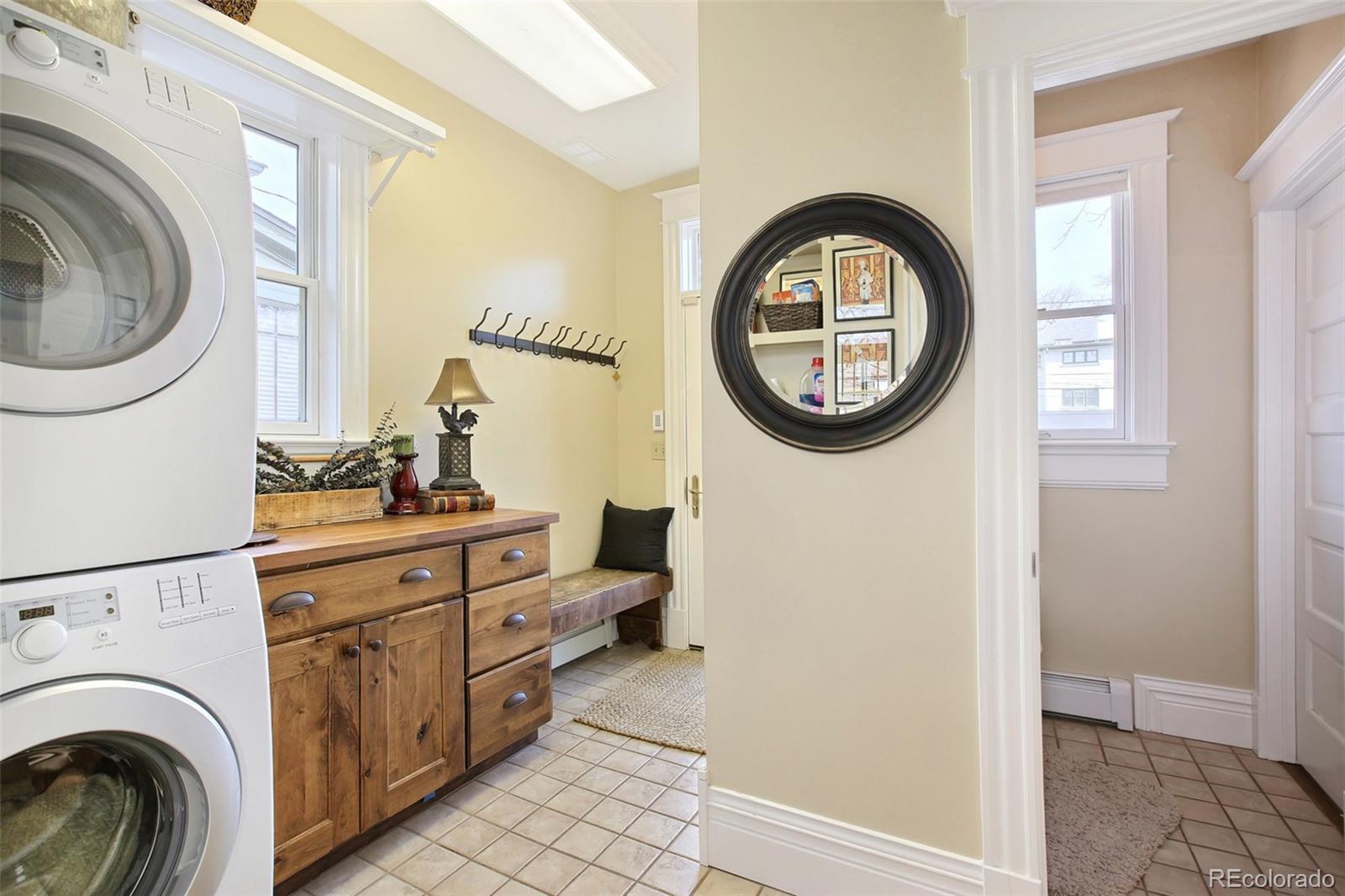 570 Gilpin Street Denver, CO 80218 - Photo 27 of 30 a view of a hallway with washer and dryer
