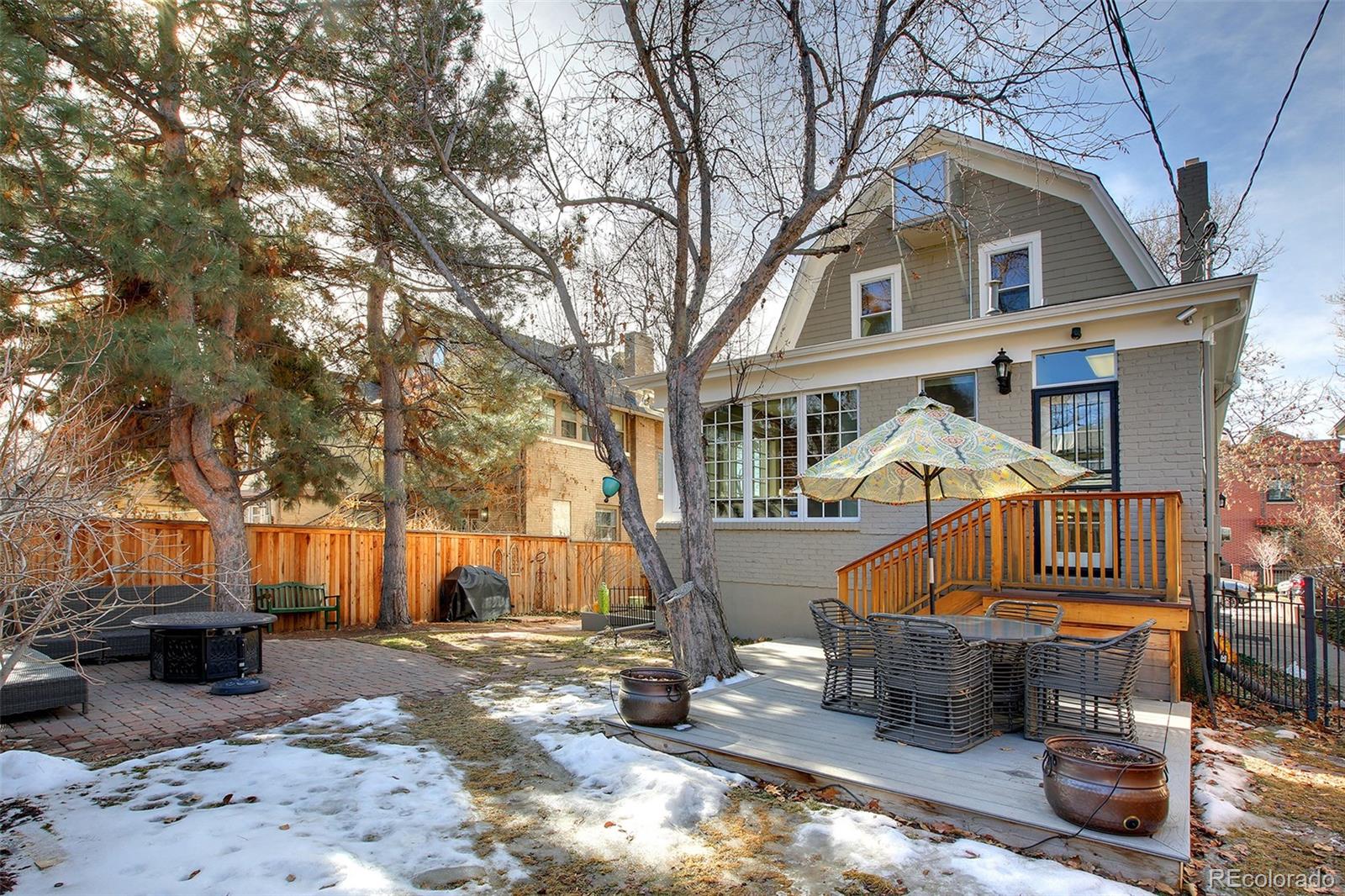 570 Gilpin Street Denver, CO 80218 - Photo 28 of 30 a front view of a house with large trees